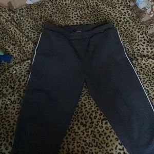 Dark grey sweatpants and a jump suit